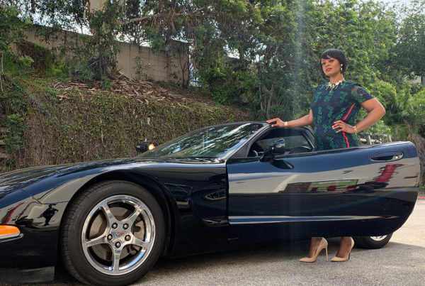 woman modeling corvette car