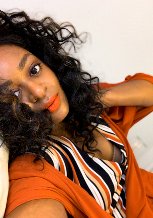 orange lipstick on black woman