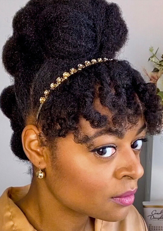 protective natural hairstyle with bangs