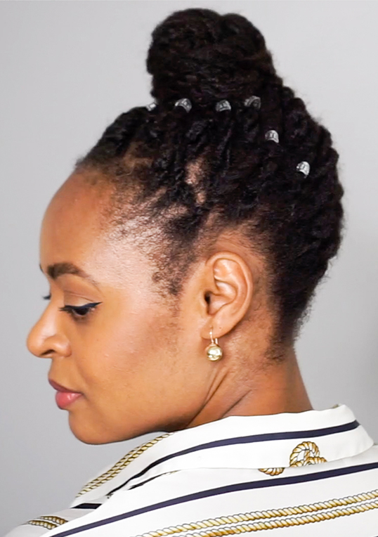 high bun natural hairstyle with mini twists