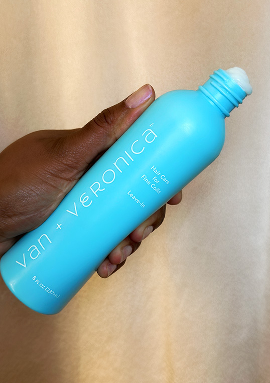 sky blue bottle being held